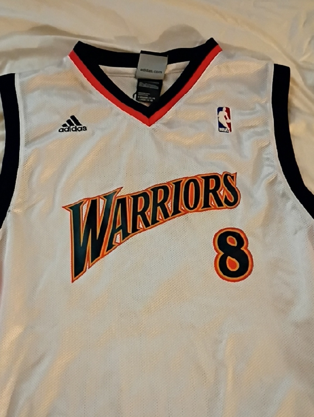 adidas White Warriors Basketball Jersey with Navy and Orange Trim